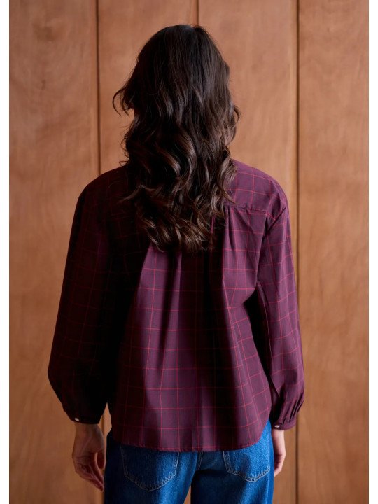 Women's loose-fitting blouse with a gathered neckline and appliqué details